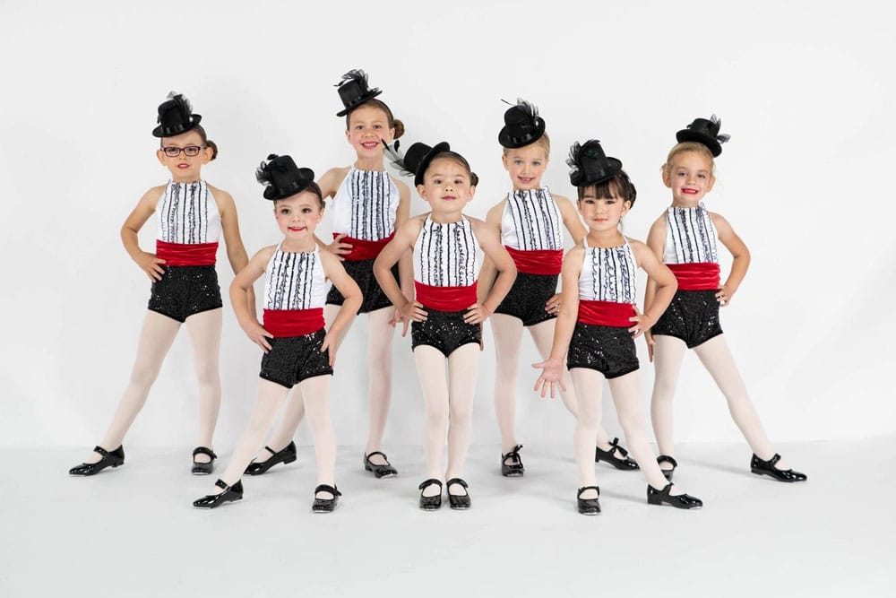A group of young dancers dressed up.