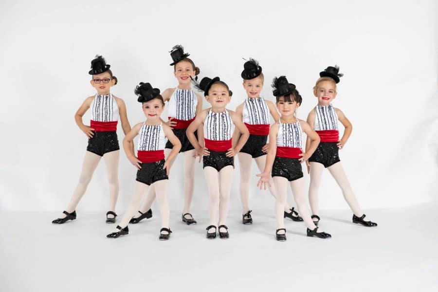 A group of young dancers dressed up.